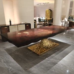 Molten Gold Pedestal Dining Table with Deep Red Burl Wood Top and Inlaid Motif